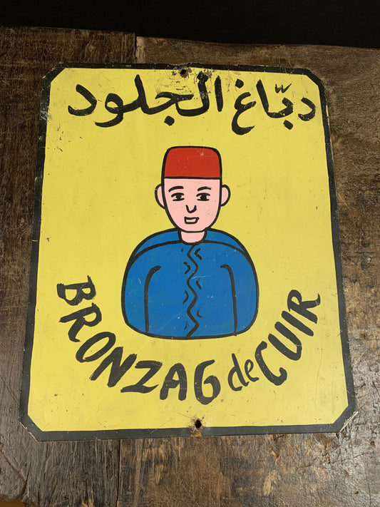 Vintage Bronzage de cuir reclame bord uit Noord-Afrika - Rootz Gallery