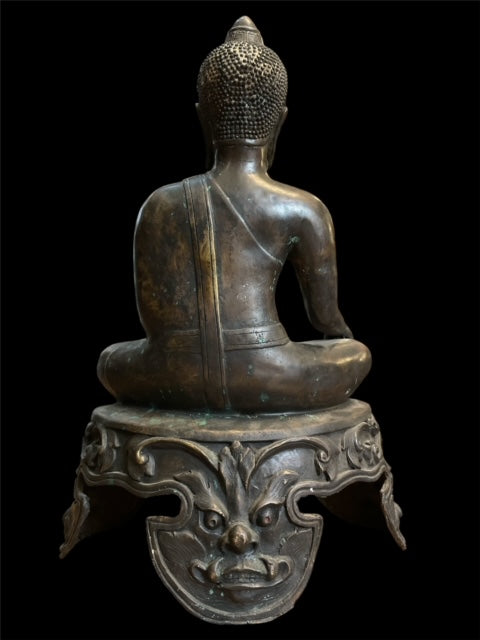 Thai Buddha on decorated pedestal