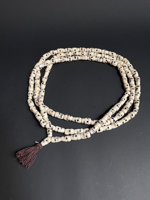 Very long yak bone necklace with skulls - white